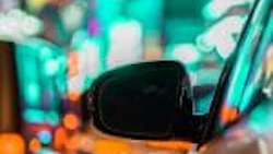 car-and-rear-view-mirror-in-city-traffic-with-ligh-2022-11-04-06-42-28-utc-150×150-1