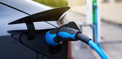 electric-car-refueling-at-a-charging-station-2022-02-08-14-57-32-utc