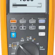 Fluke 283 FC True RMS 1500V digital multimeter displaying 1500 VDC reading with auto range setting